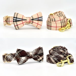 May include: Two dog collars and bow ties. One set is brown and white plaid, the other is beige and red plaid.