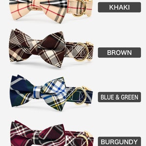 May include: Four dog collars with bow ties in different plaid patterns. The collars are khaki, brown, blue and green, and burgundy.  The collars have gold metal buckles.