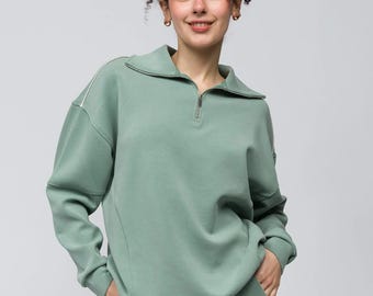 Sweater van modalmix met rits, biezen en hoge lage zoom Groen