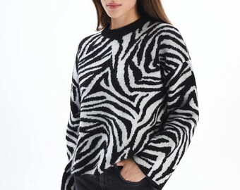 Kabeltrui met zebraprint en ronde hals