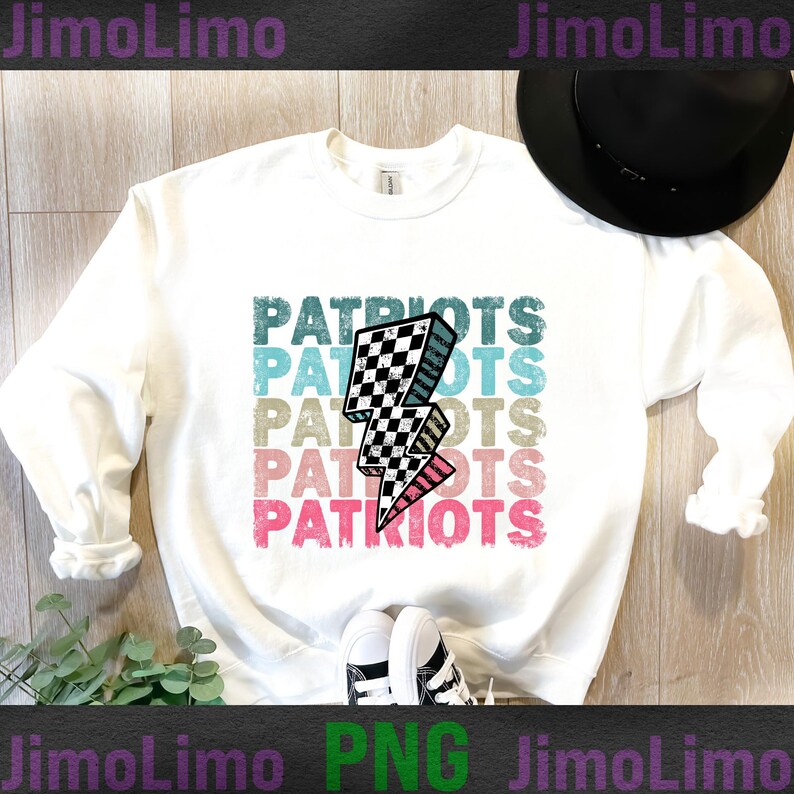 May include: White long-sleeved sweatshirt with the word "PATRIOTS" in a stacked design. A black and white checkered lightning bolt graphic is centered on the shirt. The text and graphic have a distressed, vintage look.