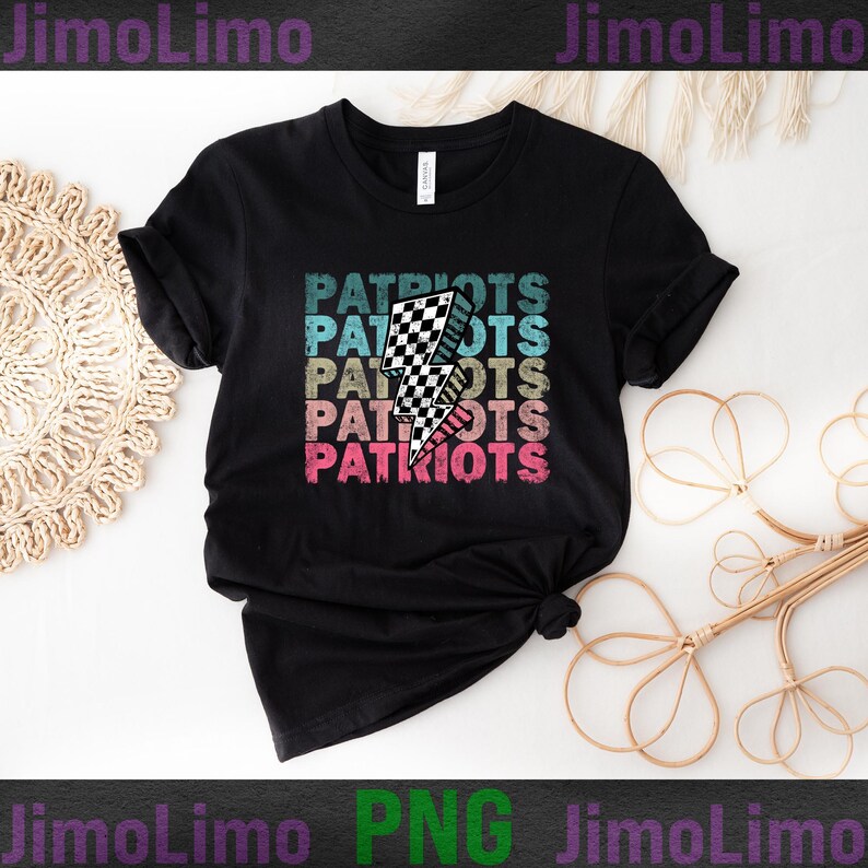 May include: Black t-shirt with the word "PATRIOTS" stacked in a retro font. A checkered lightning bolt graphic is centered on the shirt. The text is in teal, blue, tan, and pink. The shirt has short sleeves and a crew neck.