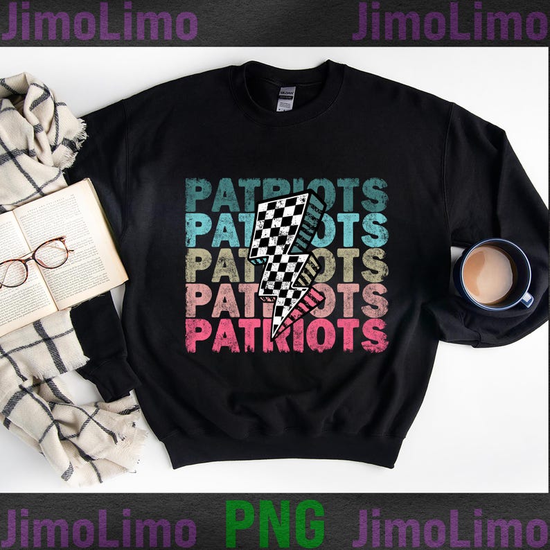 May include: Black sweatshirt with the word "PATRIOTS" stacked in a retro font, with a checkered lightning bolt graphic. The text is in shades of blue, tan, and pink. A cup of coffee, a book, and glasses are in the background.