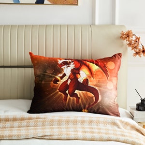 May include: A decorative pillow with a red and orange dragon illustration. The dragon has white fur and is surrounded by a glowing light effect.