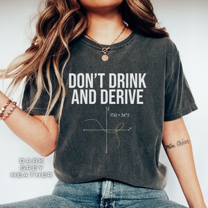 May include: Dark heather grey t-shirt with a white graphic that says "Don't Drink and Derive" with a mathematical equation and graph.