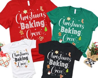 May include: Four Christmas-themed shirts in red, green, black, and white. Each shirt features the text "Christmas Baking Crew" in a festive font, along with gingerbread men, stars, and Christmas tree graphics. A onesie is also included.