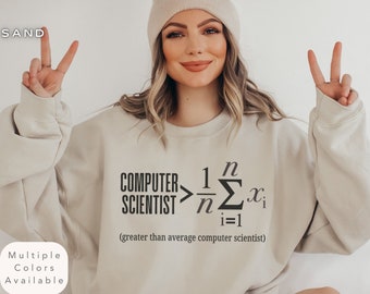 May include: A beige sweatshirt with the text "COMPUTER SCIENTIST > 1/n Σ(i=1 to n) x_i (greater than average computer scientist)" printed on the front.