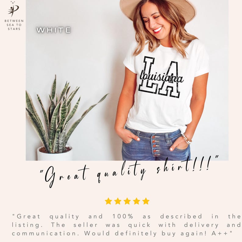 May include: White t-shirt with the word "Louisiana" in a black, distressed font. The shirt has a crew neck and short sleeves. The text "Great quality shirt!!!" is written below the shirt.