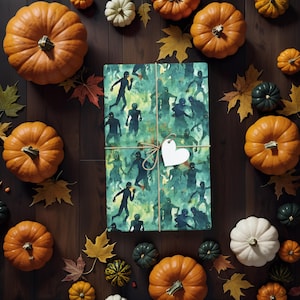 May include: A green and blue wrapping paper with a pattern of zombies. The paper is wrapped around a gift box and tied with a string. A white heart-shaped tag is attached to the string.
