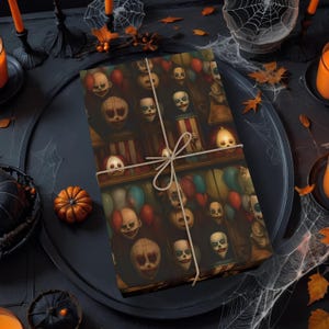 May include: A rectangular gift box wrapped in paper featuring a repeating pattern of clown faces and colourful balloons, tied with a thin beige string. The design includes multiple clown heads with painted features and red noses.