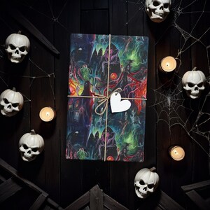 May include: A black and green gift wrap with a spooky Halloween theme. The wrap features a variety of spooky characters and imagery, including ghosts, witches, and bats. The wrap is tied with a brown twine bow and a white heart-shaped tag.