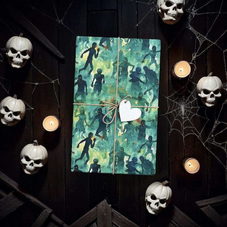 May include: A green and blue wrapping paper with a pattern of zombies. The paper is tied with twine and a white heart-shaped tag.
