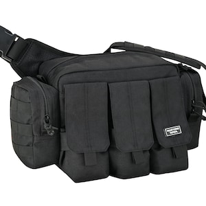 May include: Black tactical shoulder bag with multiple pockets and compartments. Features a large main compartment, several front pockets, and a side pocket with a zipper. Includes a shoulder strap and a waist strap with a buckle. The bag has a "Valley Forge Tactical" label.