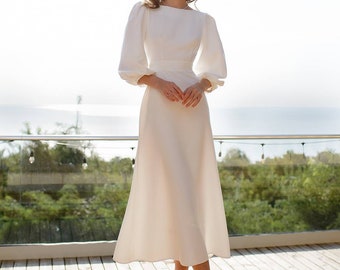 Beautiful wedding white dress with puff short sleeves and open back.Backless white midi dress. A-line Wedding guest dress