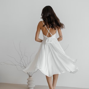 Stunning white silk dress with open back. Strappy satin circle skirt dress. V-neck briedsmaid dress midi length.  Backless event dress.