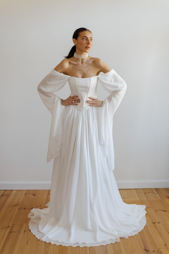 white dresses bride Andrea & Leo WL059 Floral Ruffle Bridal Ball Gown Wedding Dress featuring delicate pearl beading along the neckline Boho Mermaid Wedding Dresses Mermaid