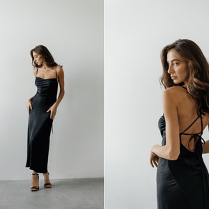 Classic black silk slip dress with spaghetti straps and open back. Maxi backless satin dress with cowl neck. A-line silk slip dress.
