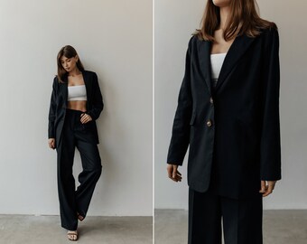 Women Minimalist wide-leg Palazzo pants suit. Black oversized two-piece linen suit. Relaxed masculine fit blazer and flowy trousers