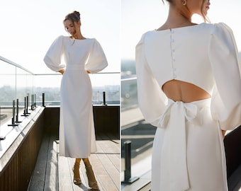 Stunning women's event dress with puffy short sleeves and open back.Backless white midi dress. A-line Wedding guest dress with short sleeves