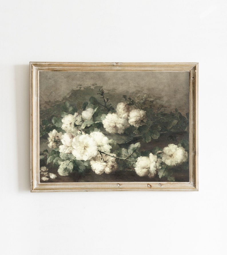 May include: A framed painting of a bouquet of white roses with green leaves on a brown background.