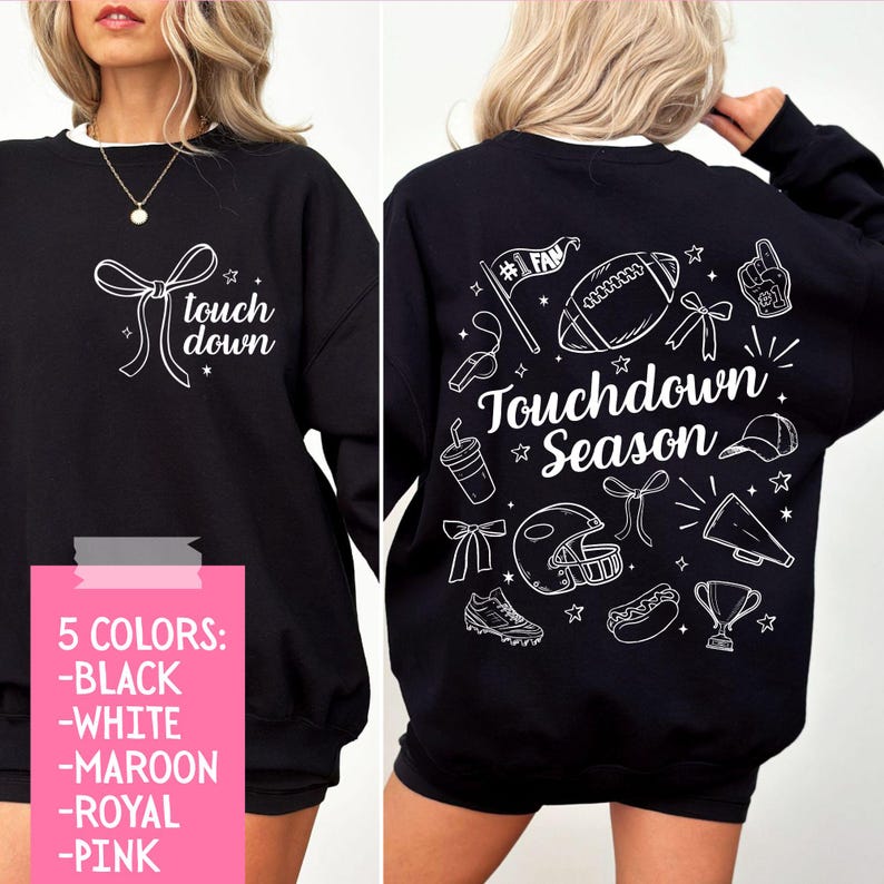 May include: Black sweatshirt with white text and graphics. The front says "touch down" with a bow graphic. The back features football-themed illustrations and the words "Touchdown Season". Available in five colors.