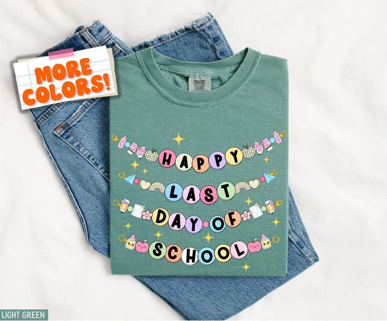 May include: Light green t-shirt with a colorful banner that reads "Happy Last Day of School".
