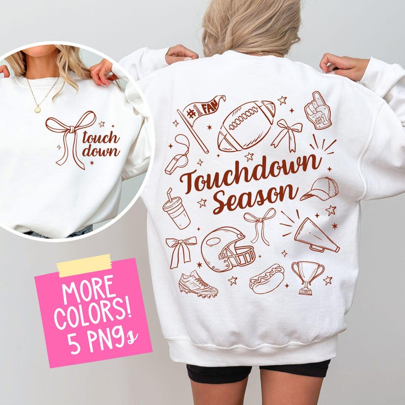 May include: White sweatshirt with brown text and graphics. The front features the words "touch down" with a bow graphic. The back displays football-themed illustrations and the words "Touchdown Season".