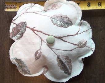 Hand sewn fabric flower pillow with button