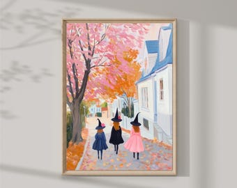 May include: Three girls dressed as witches walk down a street lined with pink and orange trees. They are wearing black hats and dresses, and one girl is wearing a pink dress. The street is lined with houses, and there are leaves on the ground.