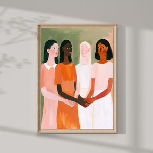 Op de afbeelding: Een ingelijste kunstdruk met een schilderij van vier figuren met verschillende huidtinten, die elkaars handen vasthouden. De figuren zijn gekleed in tinten oranje, roze en wit, tegen een groene en roze achtergrond. Het kunstwerk zit in een houten lijst.