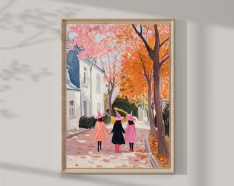 May include: Three girls wearing pink witch hats walk down a street lined with trees. The trees have orange and pink leaves. The girls are wearing pink and orange dresses. The street is paved with gray stones.