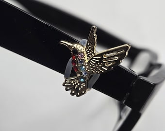 Adorno para gafas con forma de colibrí de metal esmaltado dorado y diamantes de imitación multicolores | Joyería para gafas