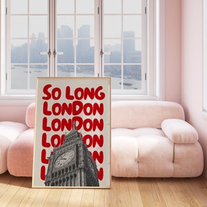May include: A framed print with a white background and red text that reads "So Long London" repeated multiple times. The print features a black and white image of Big Ben in the background.