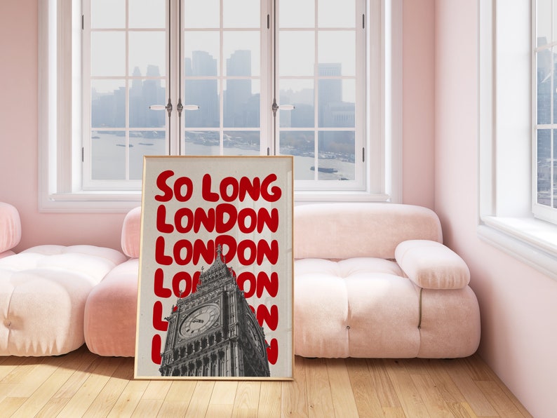 May include: A framed print with a white background and red text that reads "So Long London" repeated multiple times. The print features a black and white image of Big Ben in the background.