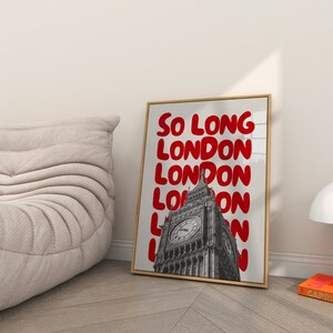 May include: A framed print with a black and white photo of Big Ben in London. The text "So Long London" is repeated in red bubble letters.