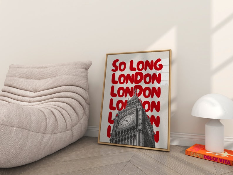 May include: A framed print with a black and white photo of Big Ben in London. The text "So Long London" is repeated in red bubble letters.