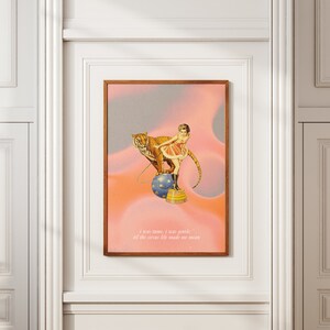 May include: A vintage-style illustration of a woman in a pink dress riding a tiger on a blue and white ball. The background is a pink and gray gradient with the text "I was home, I was gentle, till the circus life made me mean."