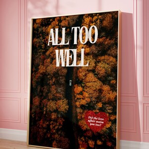 May include: A framed print with an aerial photograph of a forest in autumn colors. The text "ALL TOO WELL" is printed in white on the image. A red heart with the text "Did the love affair maim you too?" is in the lower right corner of the image.