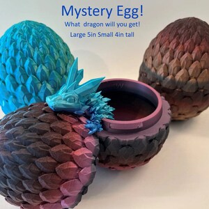 May include: A blue, purple, and black dragon egg with a small blue dragon figurine inside. The egg is 5 inches wide and 4 inches tall. Mystery Egg! What dragon will you get!