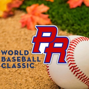 May include: A white baseball with red stitching sits on a brown and green surface. The letters "PR" in red and blue are behind the baseball. The text "WORLD BASEBALL CLASSIC" is below the baseball.