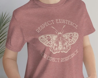 May include: A heather red t-shirt with a white butterfly graphic and the text "Respect Existence or Expect Resistance".