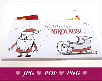 以下が含まれることがあります： サンタクロースとそりが描かれた白い箱。箱には「fröhlichen Nikolaus!」「Alles Gute zum Nikolaus!」の文字が印刷されています。