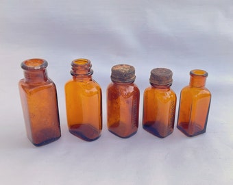 Vintage kleine bernsteinfarbene Apothekenflaschen