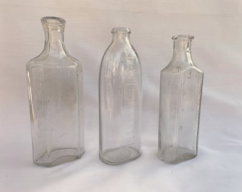 Flacons à pharmacie anciens en verre transparent