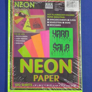 May include: A package of 100 sheets of 8.5 by 11 inch neon colored paper. The paper is bright yellow, pink, orange, and green. The package is labeled "Neon Paper" and says "Hot Fluorescent Colored Paper Brightens" with uses for announcements, flyers, newsletters, signs, and brochures. The package is also labeled "Yard Sale" in green letters.
