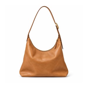 May include: A tan leather hobo bag with a smooth finish, featuring a single shoulder strap attached with a circular gold-toned metal hardware accent. The bag has a curved top opening with a zipper closure and a structured, wide base design.