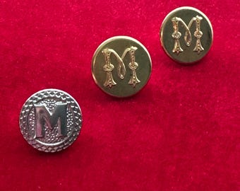 Botones de la letra M Scoville