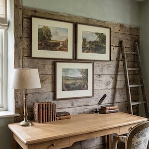 May include: A traditional home office scene with a wooden desk, a brass lamp, and framed landscape prints. A wooden ladder leans against the wall. The desk has a drawer and is paired with a patterned chair. Books and a quill pen add to the vintage feel.