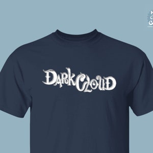 May include: Navy blue t-shirt with the text "Dark Cloud" in a stylized, white font. The shirt has short sleeves and a crew neck. The "High Tide Virginia Beach, VA" logo is in the upper right corner.