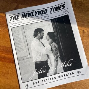 May include: A black and white newspaper-style wedding announcement titled THE NEWLYWED TIMES, dated Friday, May 30, 2025, in Parma, Ohio. It features a photograph of a couple embracing and the text Julia & Mike ARE GETTING MARRIED.